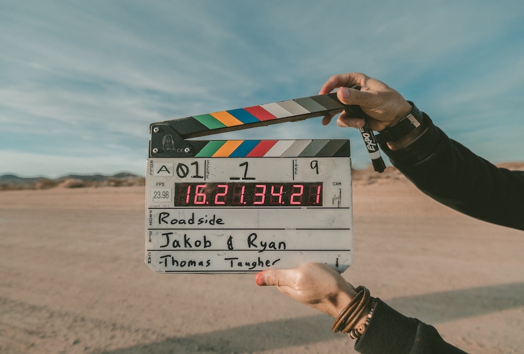 Woman holding a film clapboard
